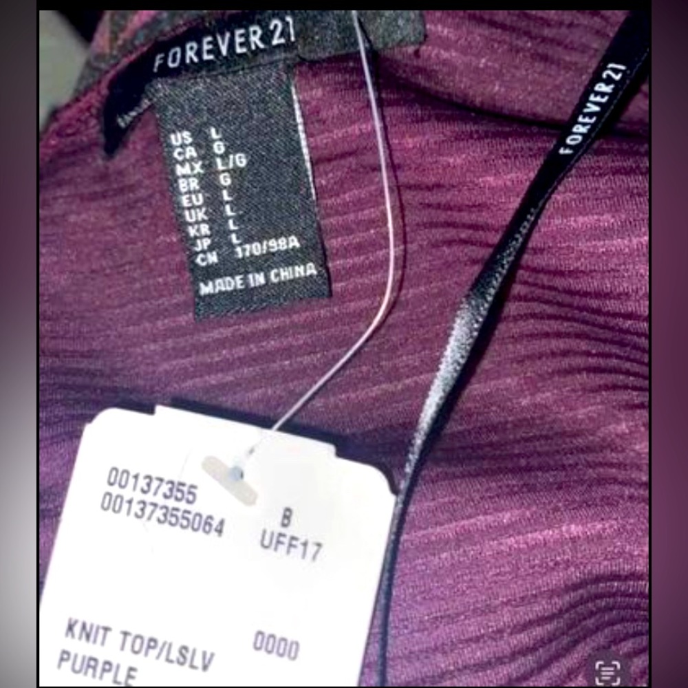 Long Sleeve Plum Knit Top. Lines thru the shirt in the pattern. It’s classy .